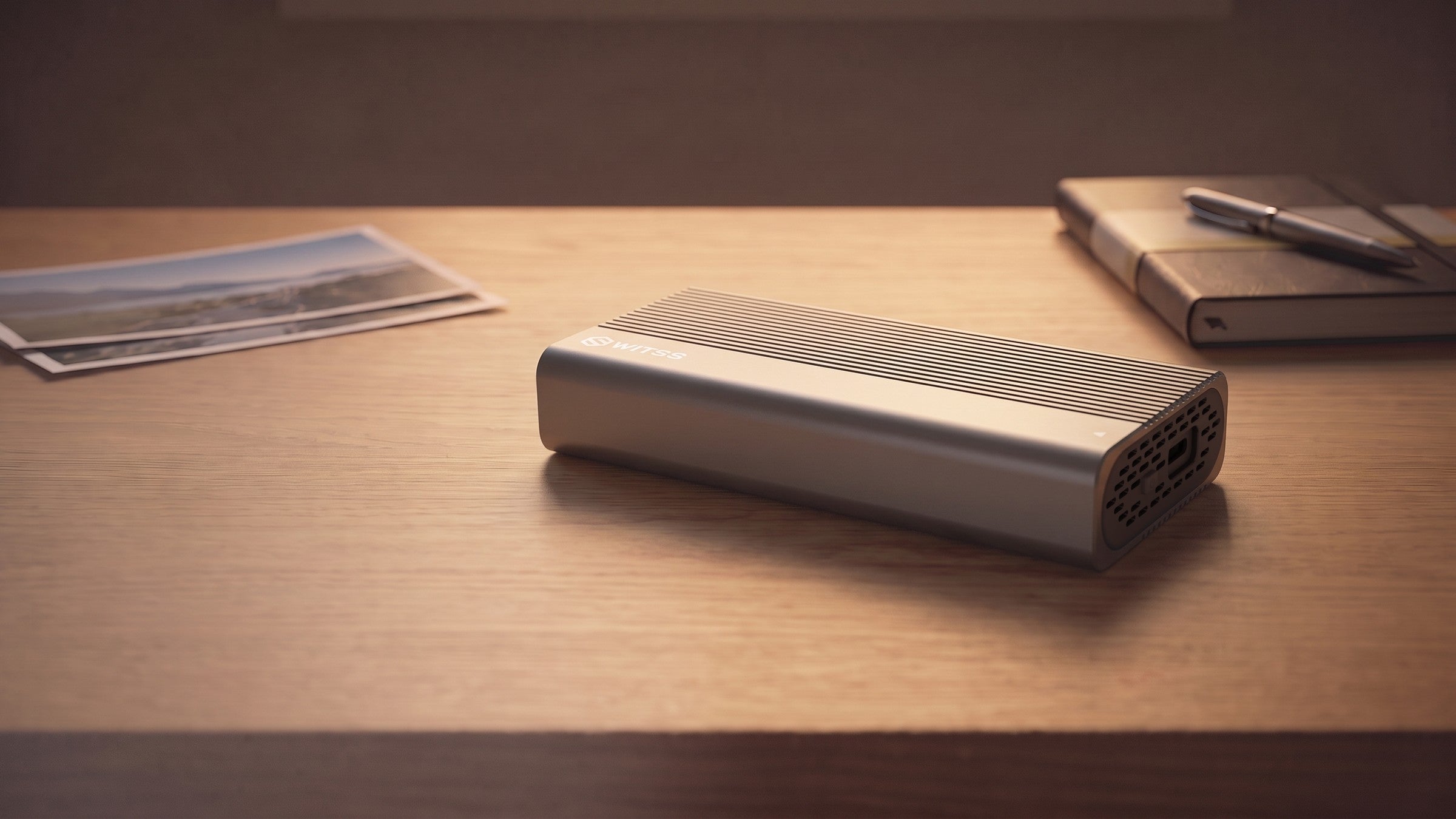 Switss® M.2 SSD enclosure USB4 on a wooden desk, lifestyle shot